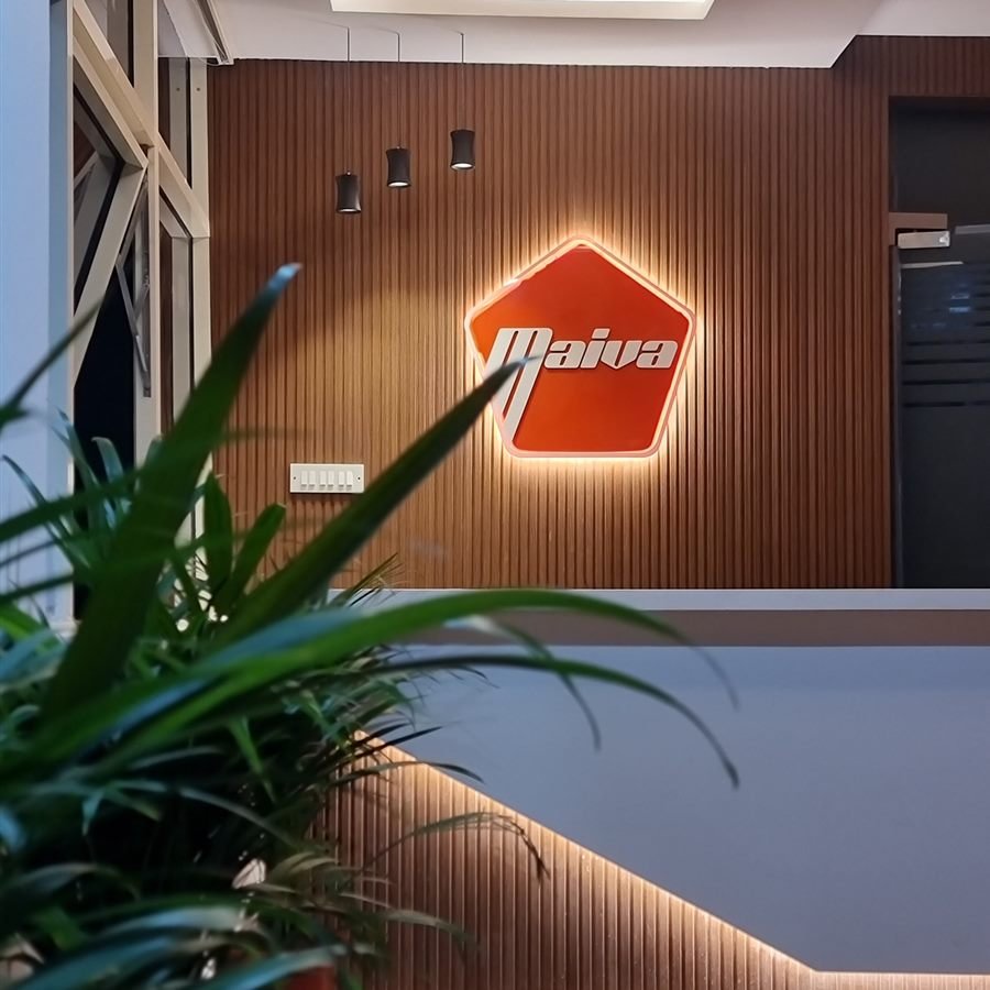Maiva Pharma reception with backlit logo on timber fluted wall